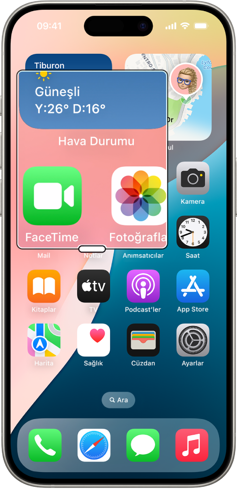 Ekranın bir bölümünün büyütüldüğü bir pencereyi içeren ana ekranı gösteren bir iPhone.